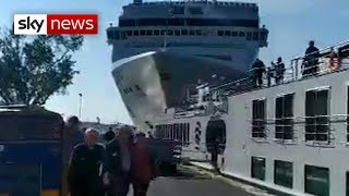 Cruise ship crashes into dock and tourist boat in Venice [upl. by Llerrud]